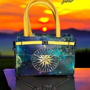 Celestial handbag with yellow handles.