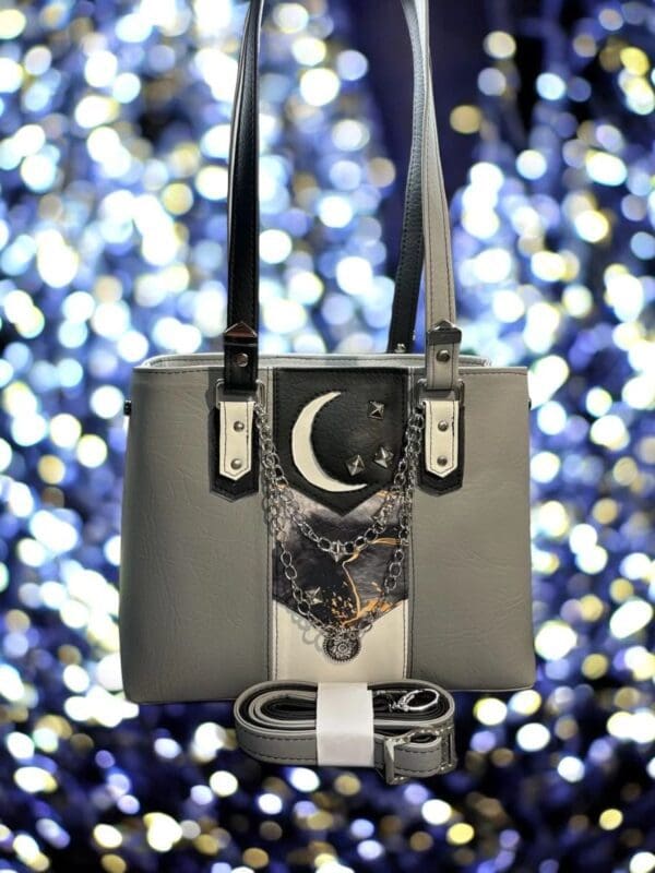 Grey moon handbag with chain detail.