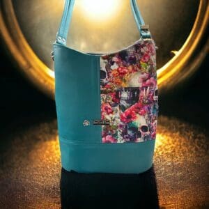 Teal floral skull handbag.