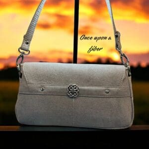 Elegant light grey crossbody bag.